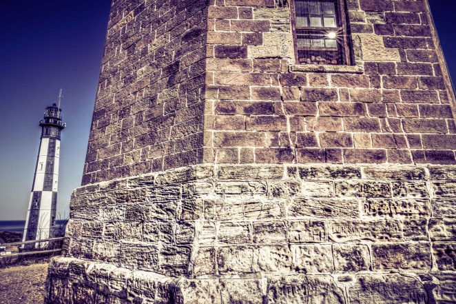 The two Cape Henry Lighthouses standing side by side in VA Beach.