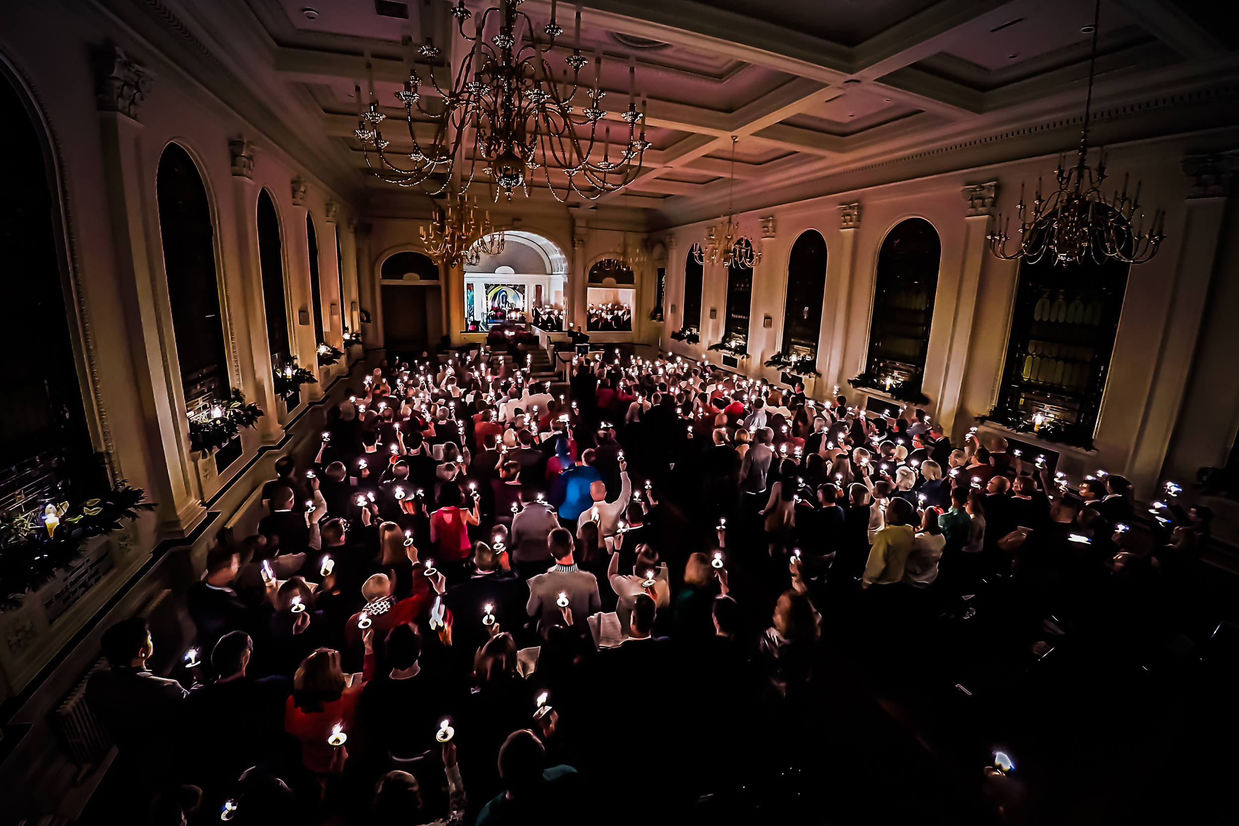 My church's sanctuary illuminated by candle light.